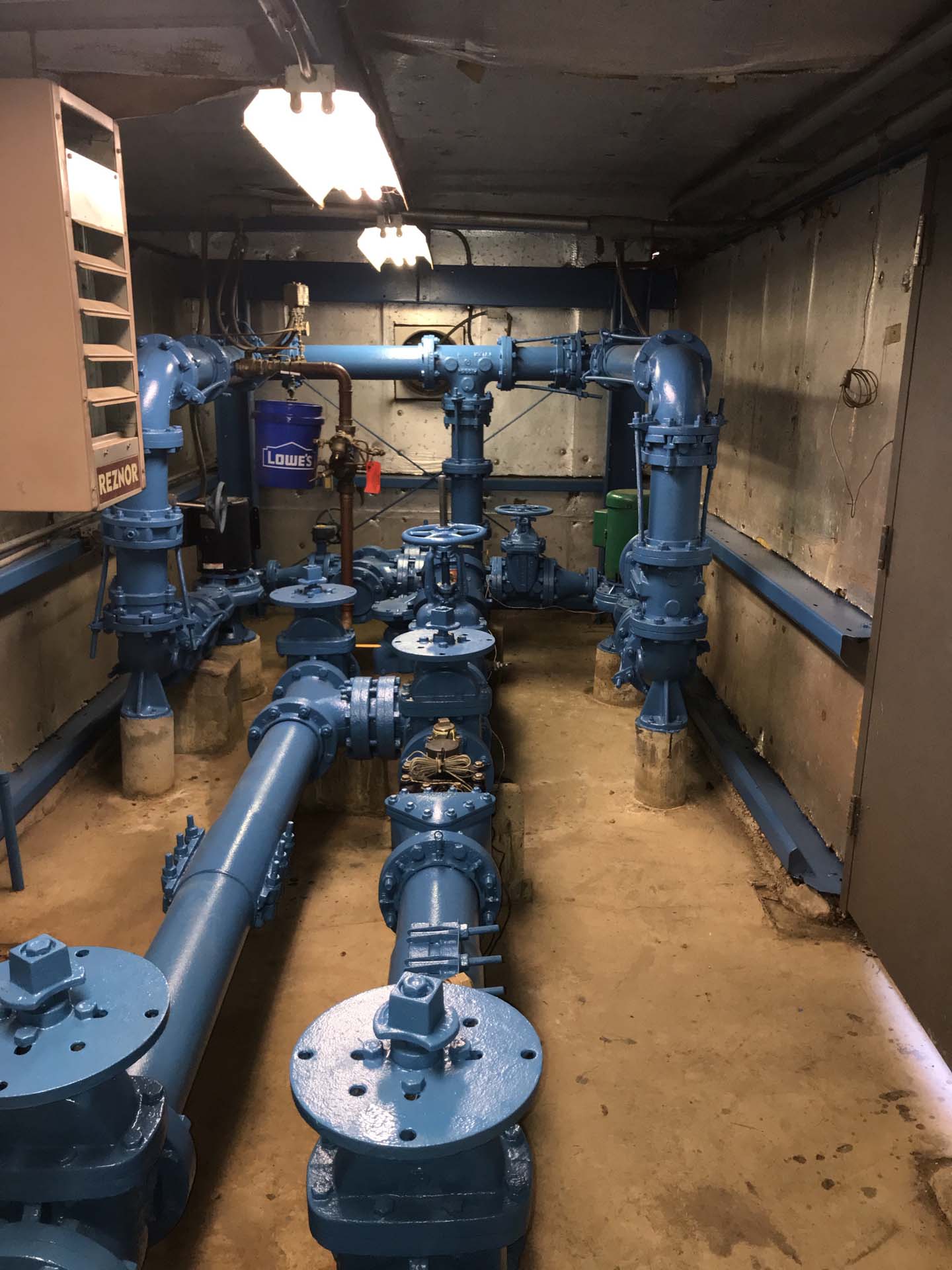 Basement of a commercial building pipes painted blue